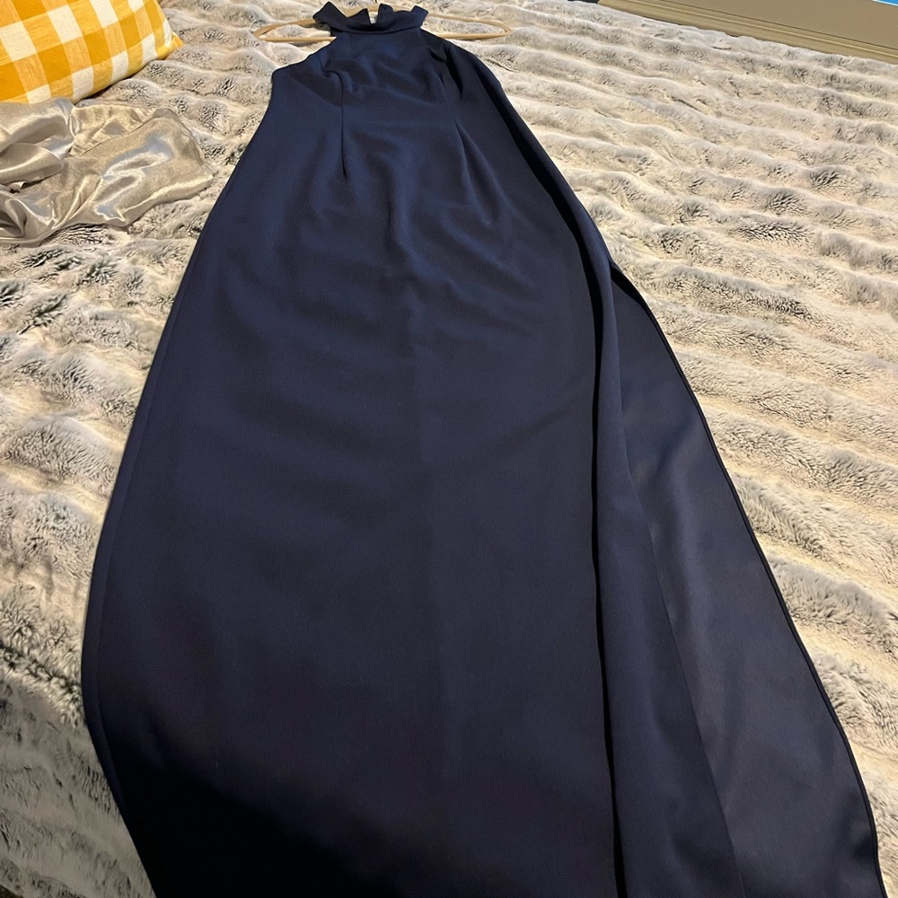 Full length navy halter top see through back dress with slit.